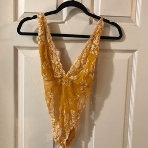 yellow lacey bodysuit
